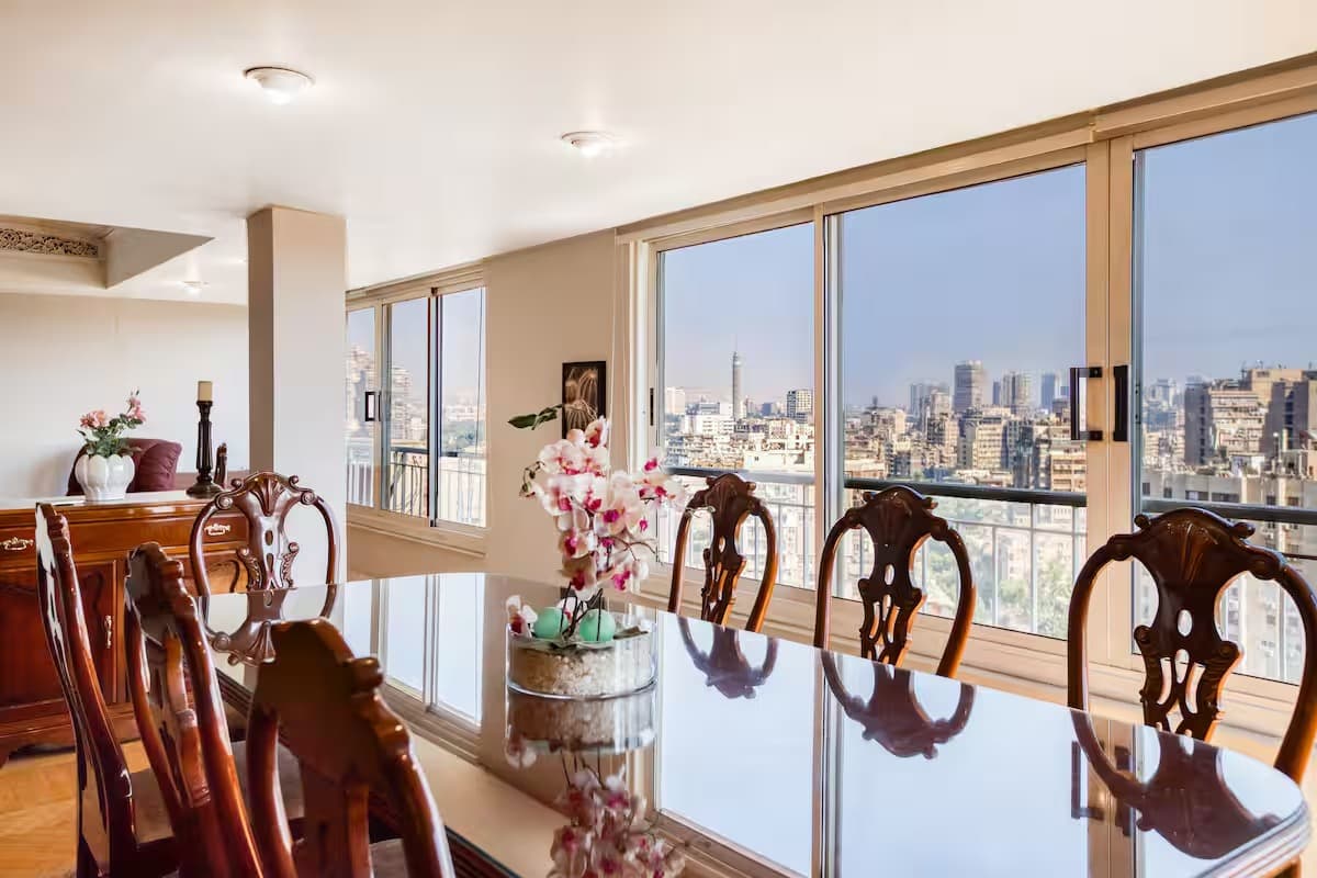 Sophisticated dining area with panoramic Cairo skyline views