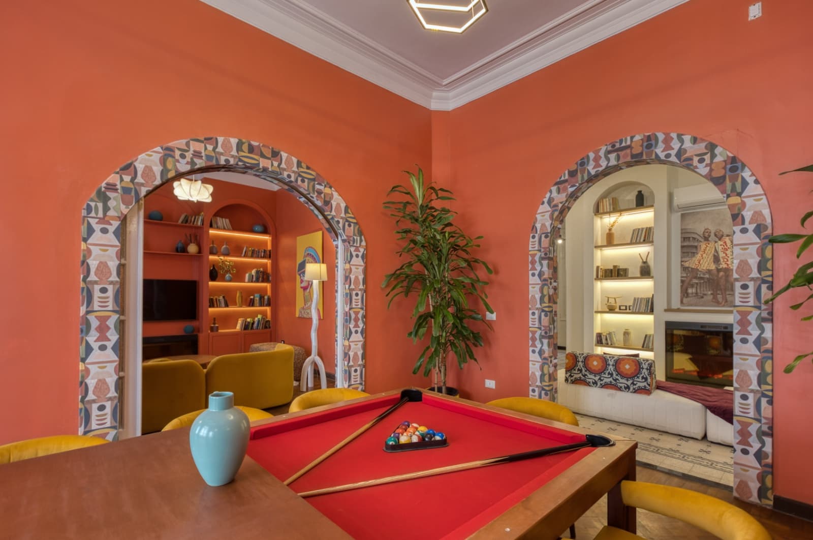 Spectacular entertainment room with pool table and decorative archways
