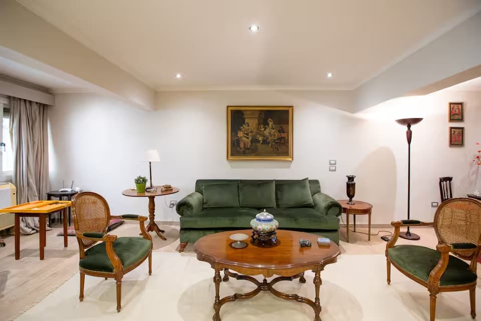 Elegant living room with classic green furniture and traditional décor