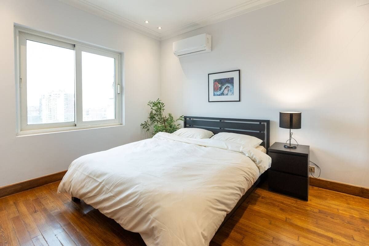 Clean minimalist bedroom with modern furnishing