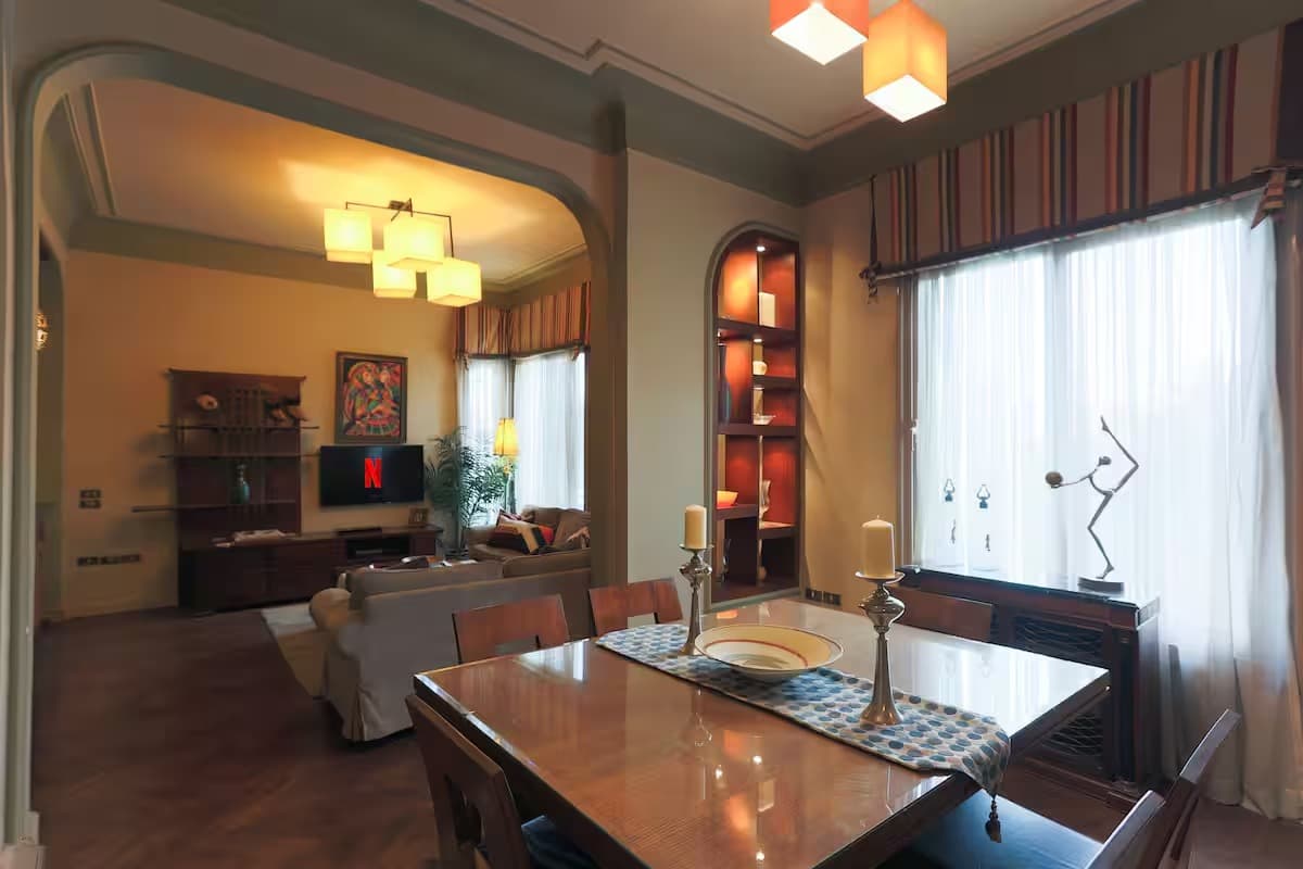 Elegant open-plan living and dining area with sophisticated design